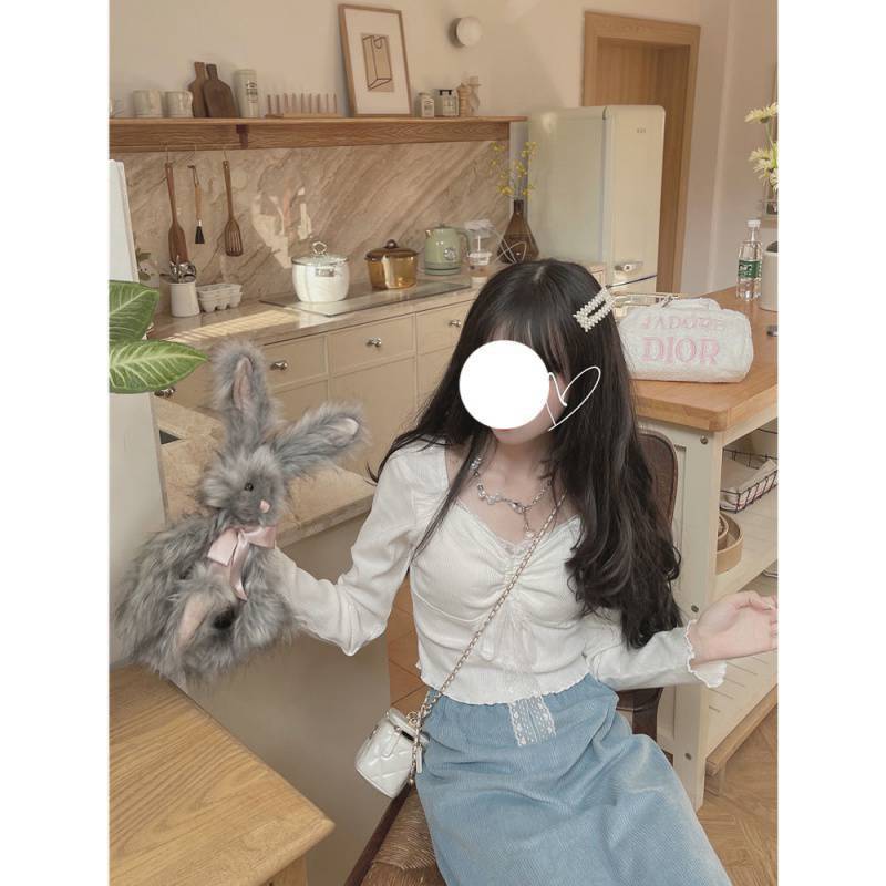 f557ea5a-8113-4922-9653-b776e6109505.jpg A Woman Wearing A Sweater With A Base Top - Image 3